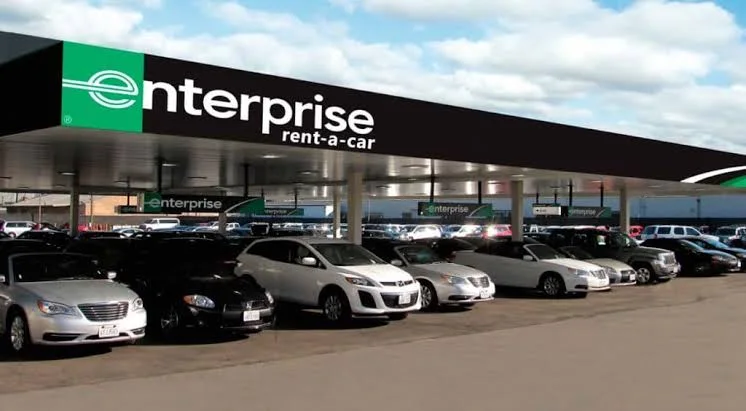 Traveller reviewing an airport car rental before starting a journey